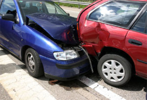 Car Accident Lawyer Port St. Lucie, FL with a blue and red car rear-ended