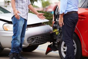 Car Accident Lawyer Fort Pierce, FL with two men arguing after a rear-end car accident