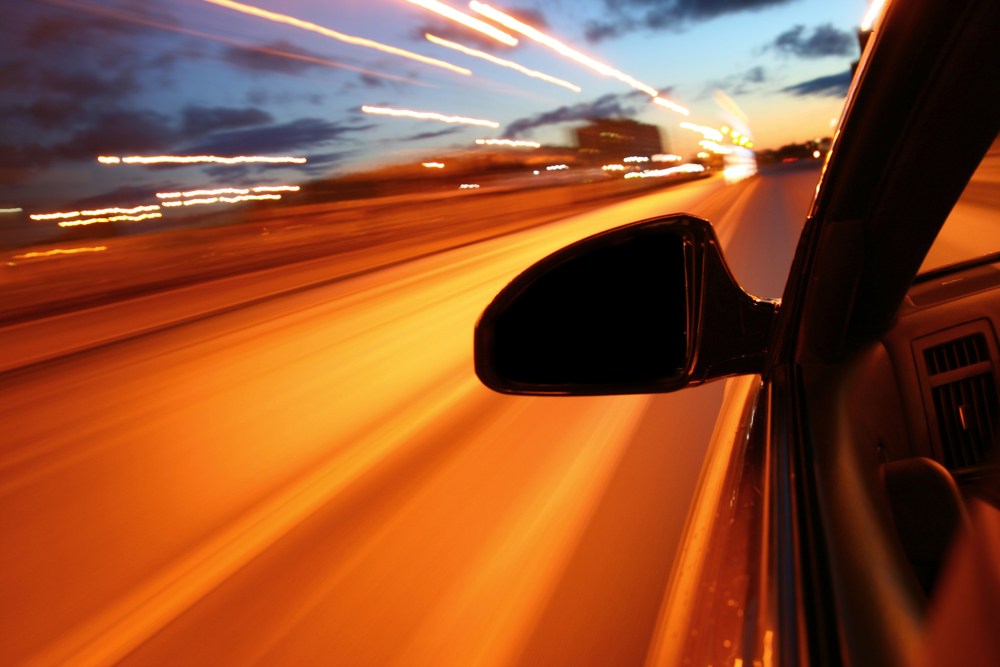 Car Accident Lawyer Okeechobee, FL - night drive motion blurred transportation background